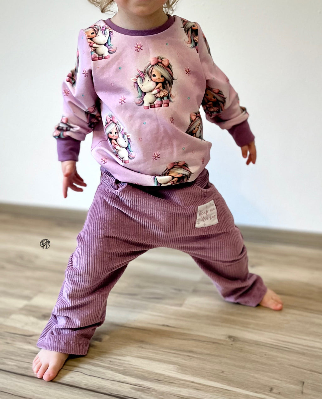 In-house production French Terry Rainbowgirl on Mélange Pink