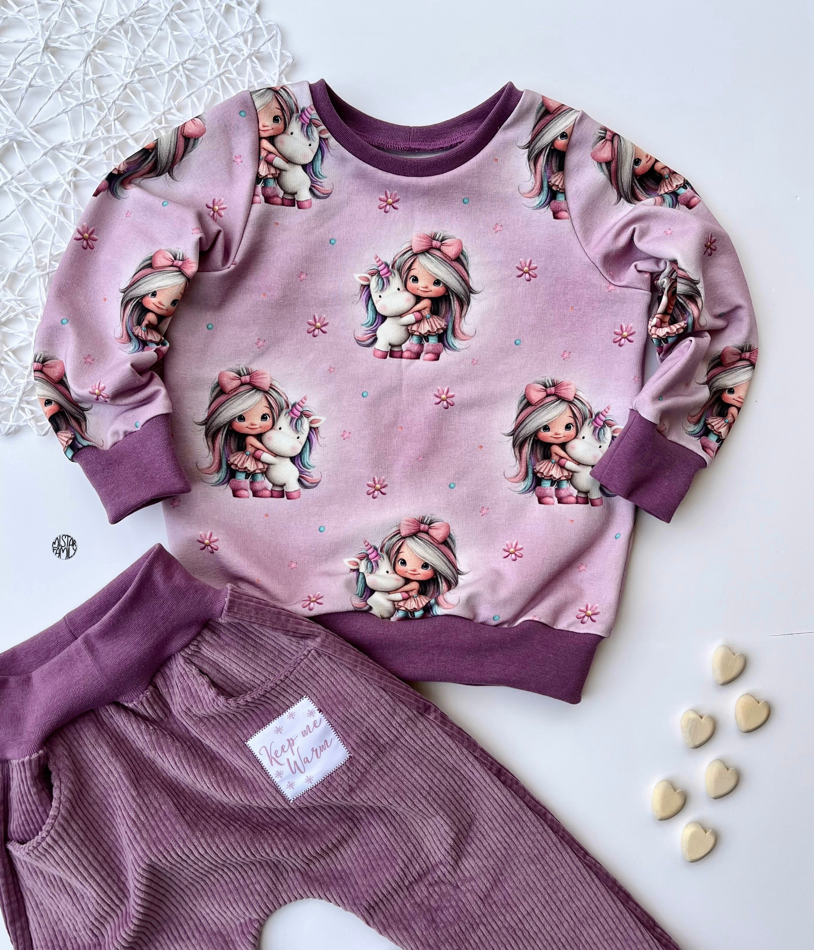 In-house production French Terry Rainbowgirl on Mélange Pink
