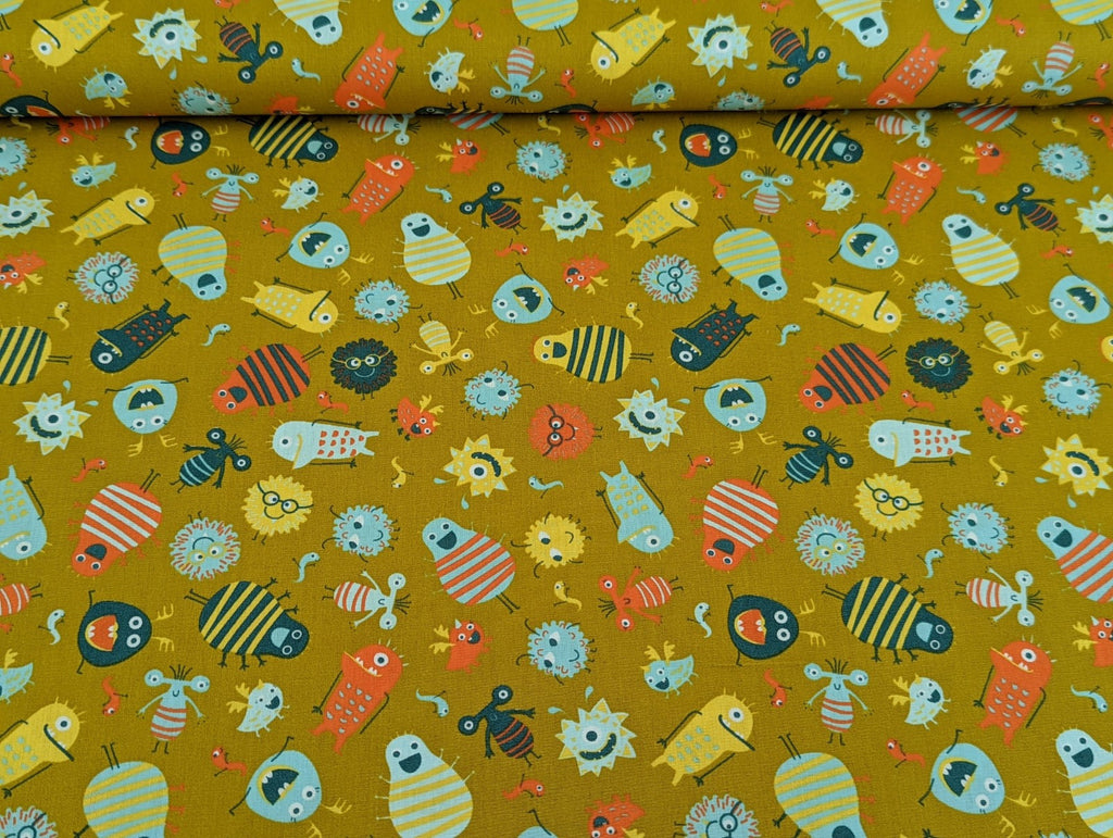 Cotton fabric Poplin Small Aliens Monsters on Mustard Yellow