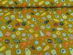 Cotton fabric Poplin Small Aliens Monsters on Mustard Yellow