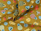 Cotton fabric Poplin Small Aliens Monsters on Mustard Yellow