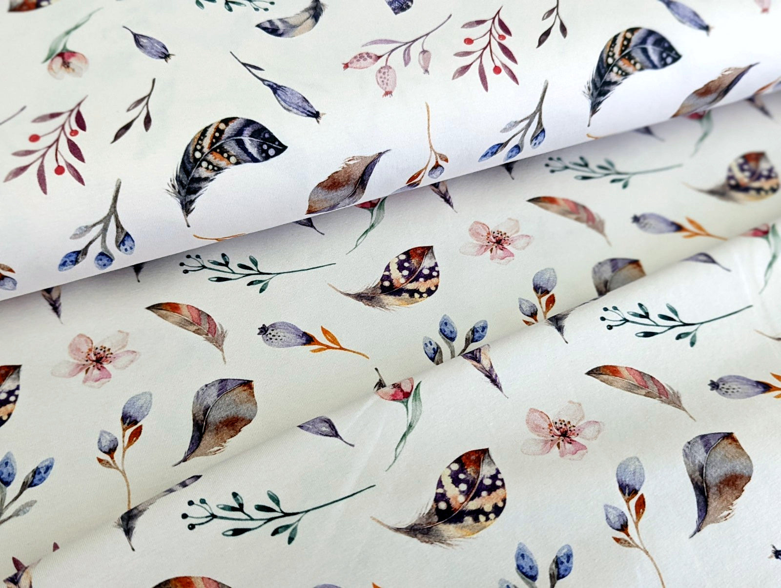 Cotton jersey Small feathers, branches, and cherry blossoms on off-white