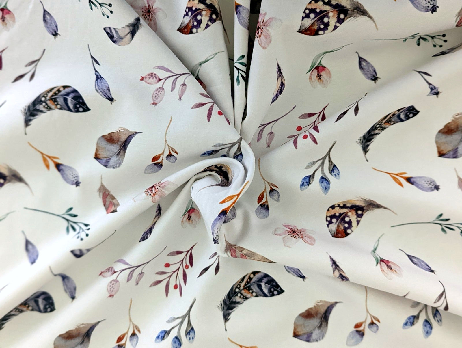 Cotton jersey Small feathers, branches, and cherry blossoms on off-white