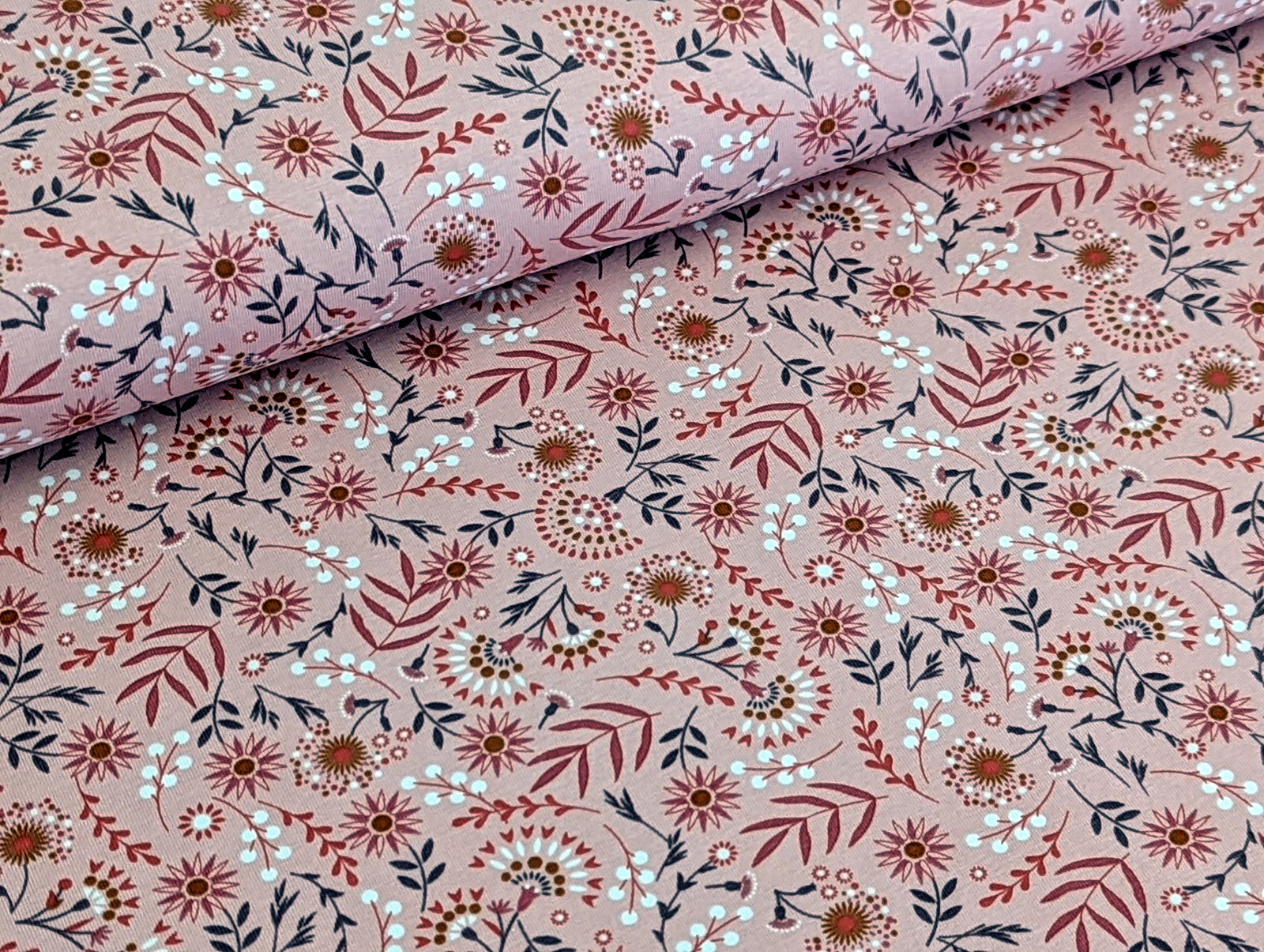 Cotton jersey floral pattern with branches on powder pink