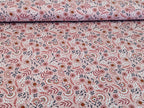Cotton jersey floral pattern with branches on powder pink