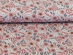 Cotton jersey floral pattern with branches on powder pink