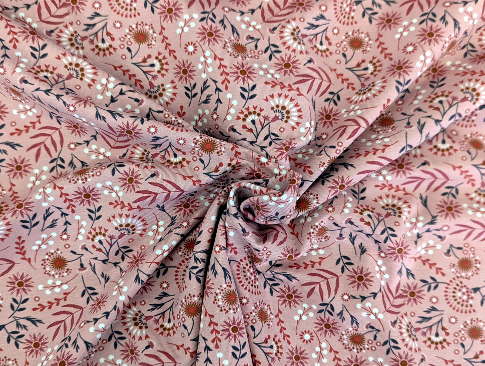 Cotton jersey floral pattern with branches on powder pink