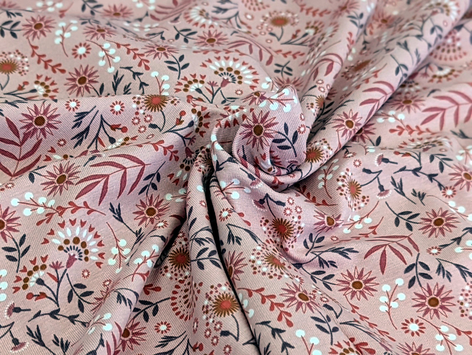 Cotton jersey floral pattern with branches on powder pink