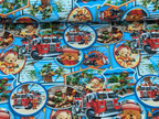 Cotton jersey teddy bear as firefighter bear on blue