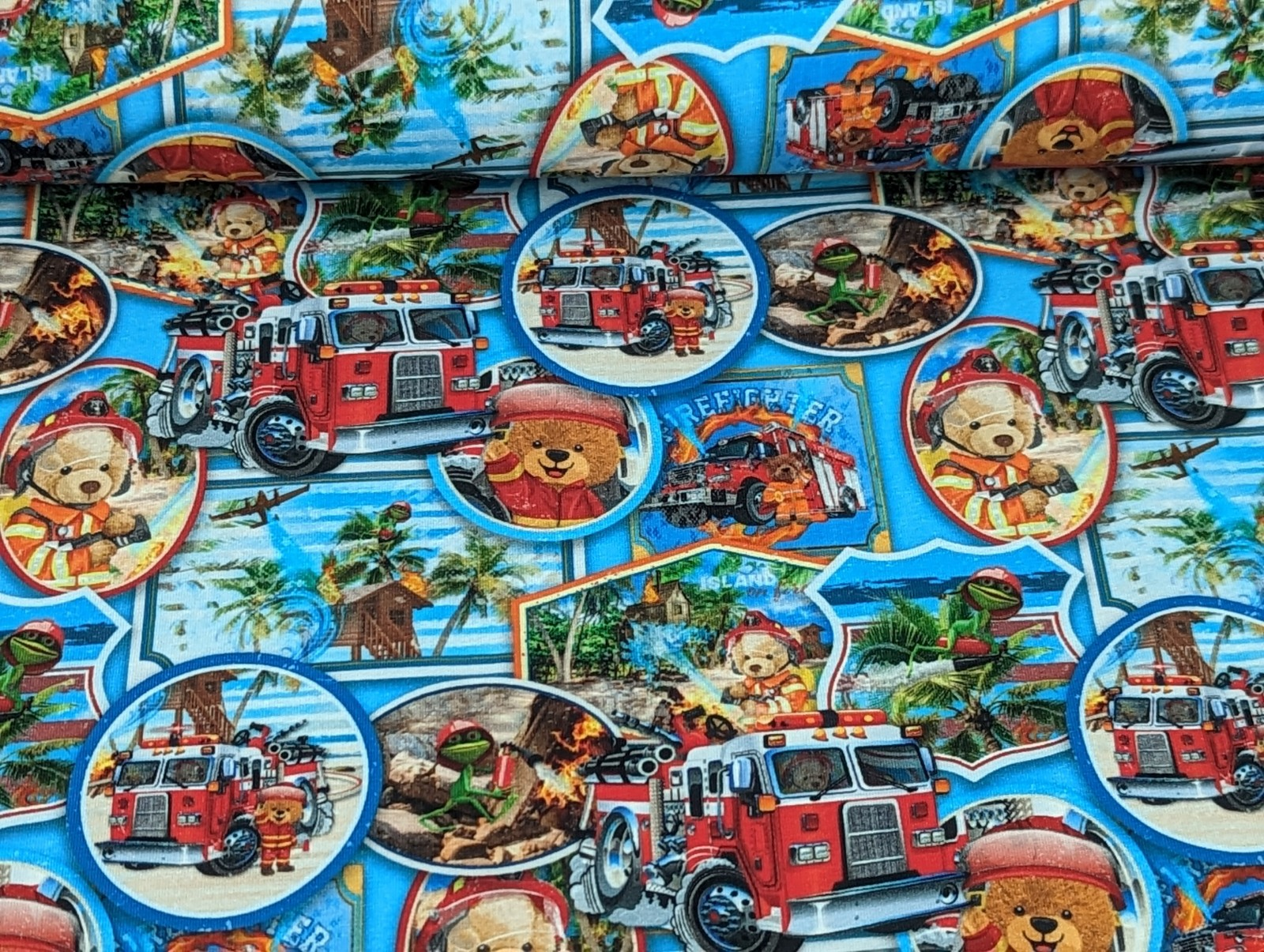 Cotton jersey teddy bear as firefighter bear on blue
