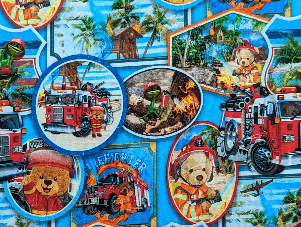 Cotton jersey teddy bear as firefighter bear on blue