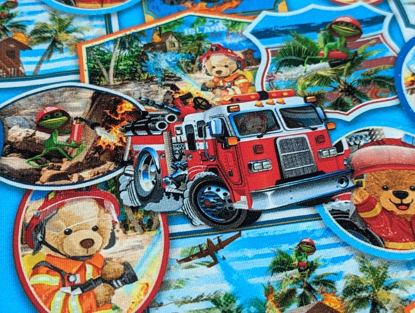 Cotton jersey teddy bear as firefighter bear on blue