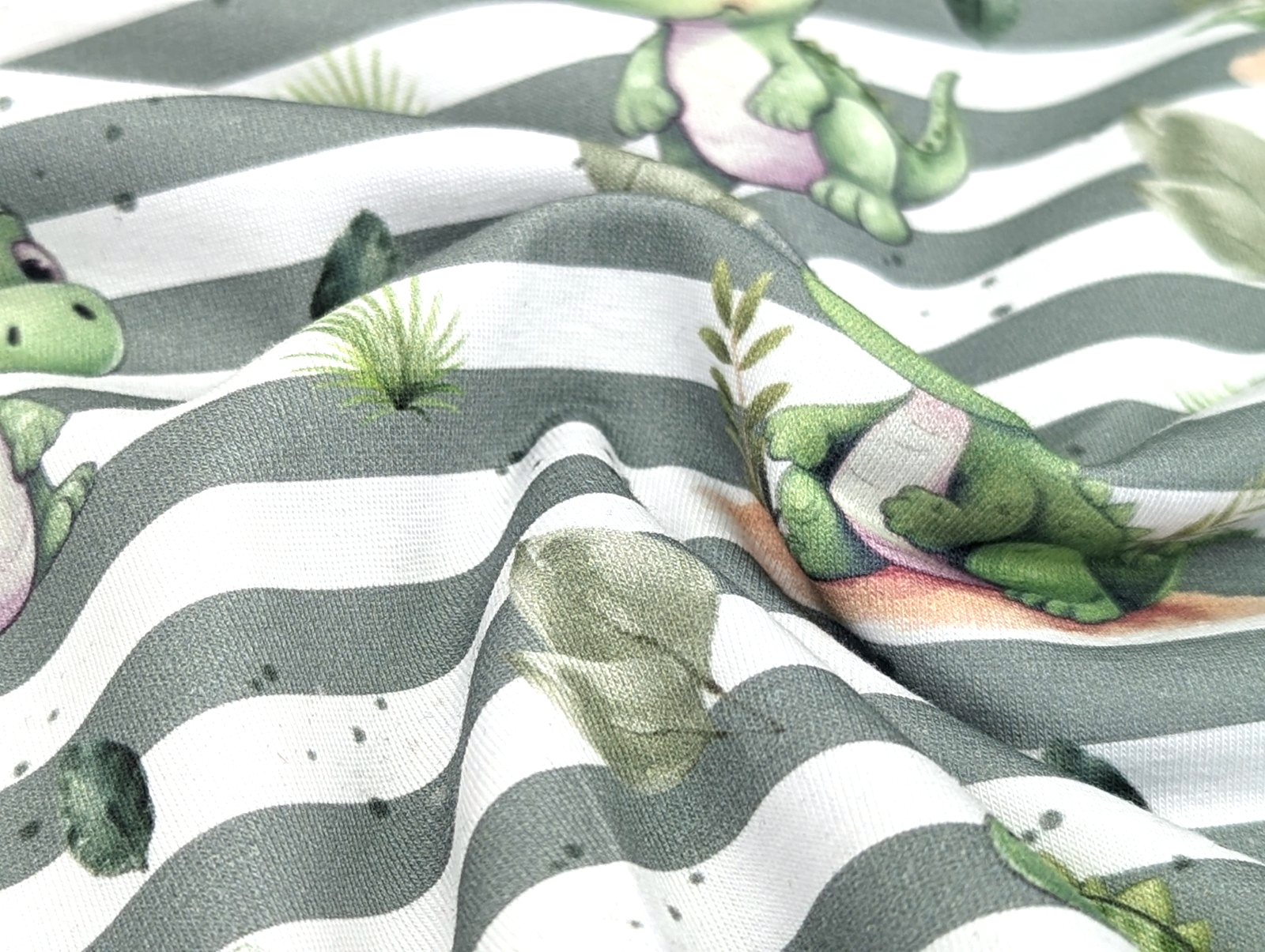 In-house production Cotton Jersey Little Dino on Green