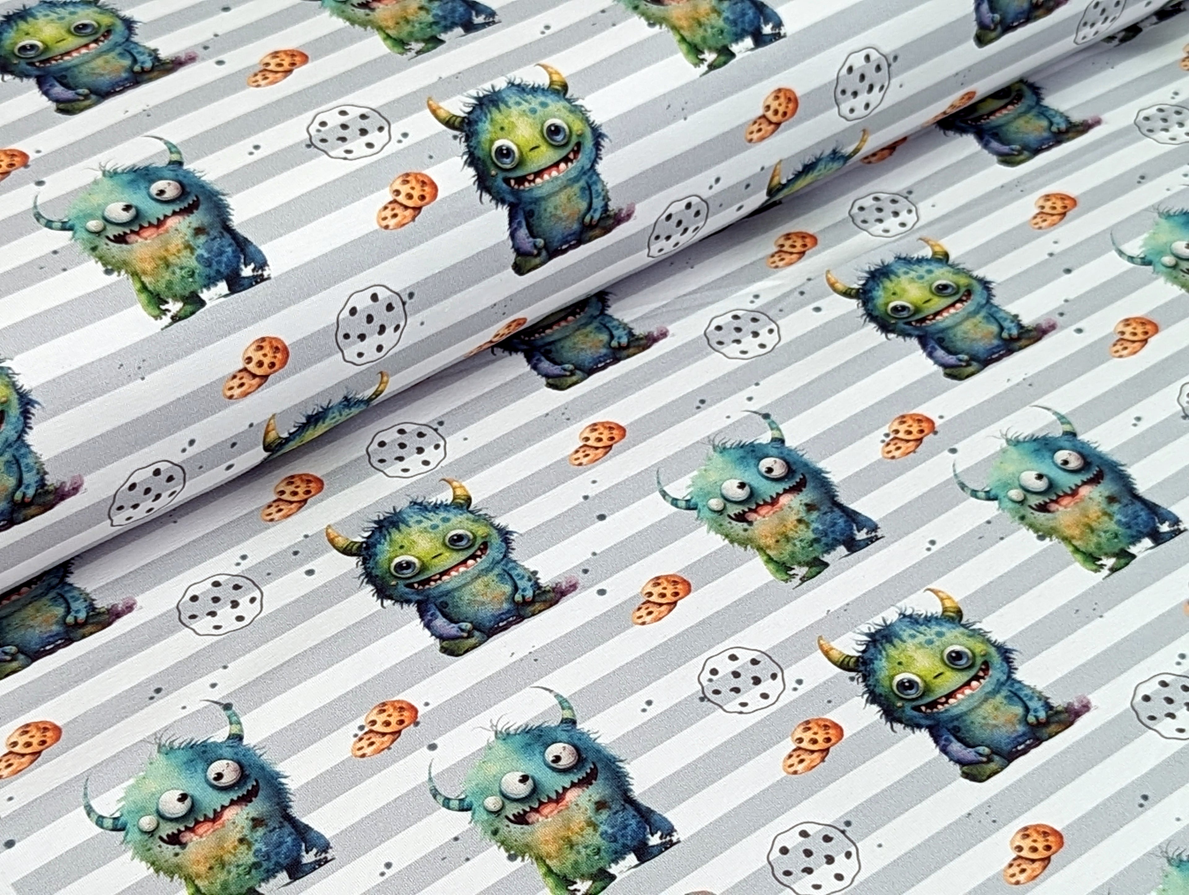 Eigenproduktion Baumwolljersey Kleines Keks Monster auf Streifen Grün / Weiß