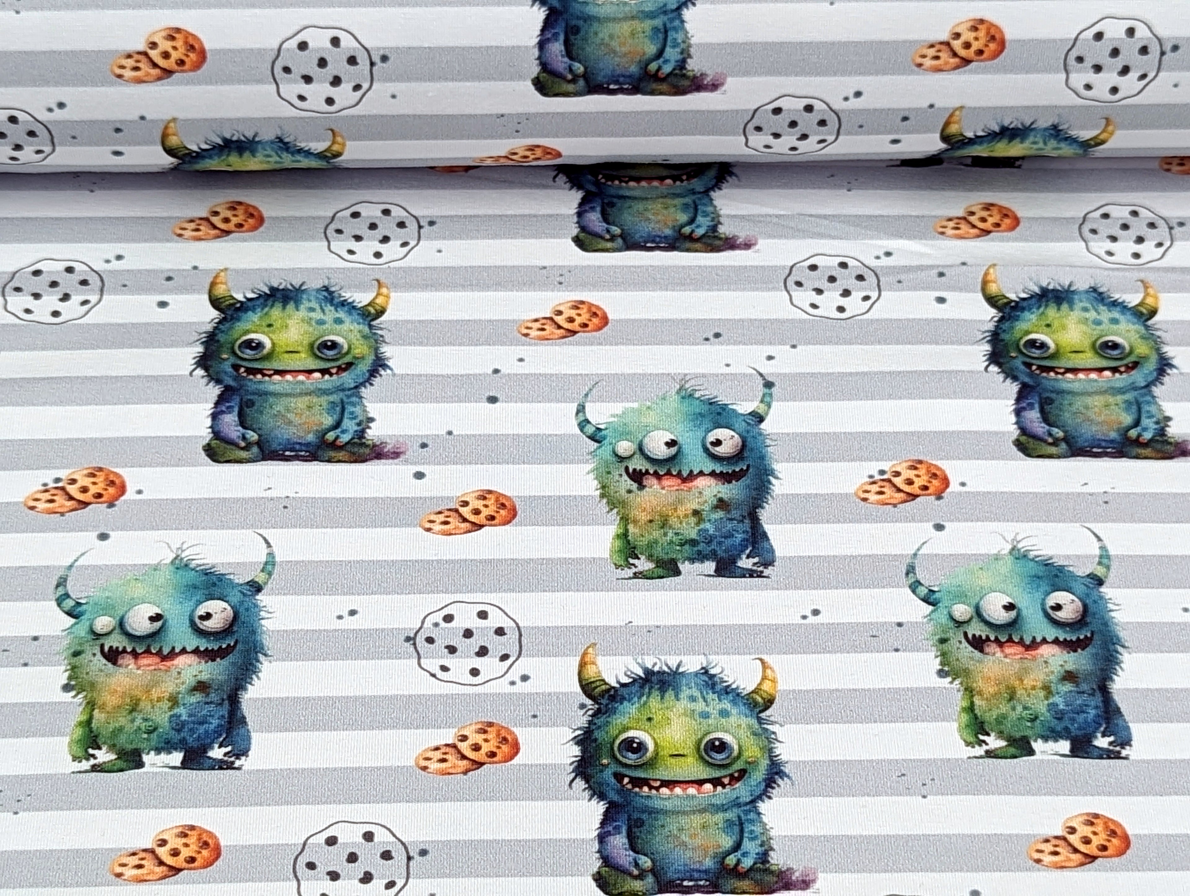 Eigenproduktion Baumwolljersey Kleines Keks Monster auf Streifen Grün / Weiß
