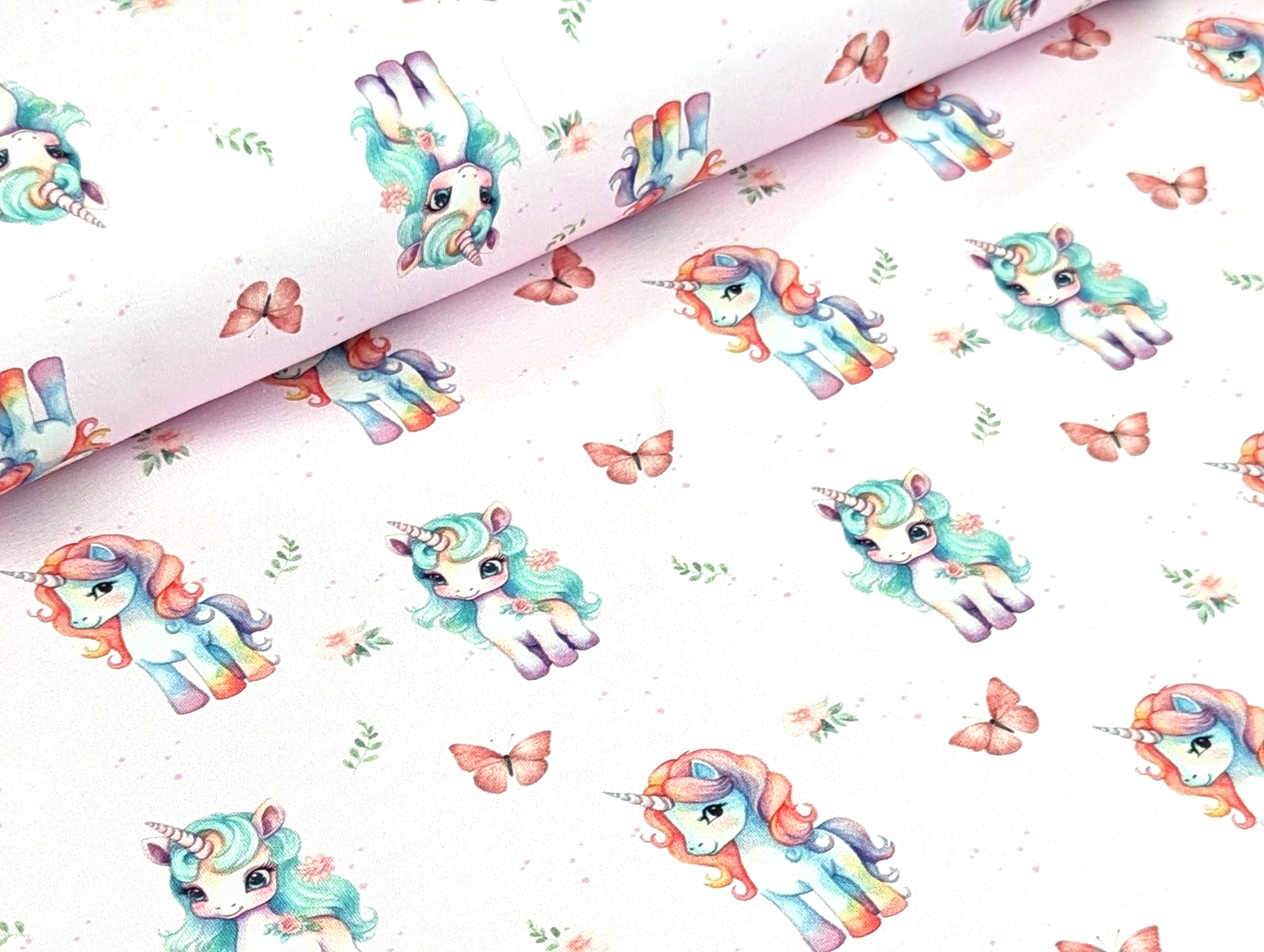 Eigenproduktion Baumwolljersey Regenbogen Unicorn Schmetterling Hellrosa