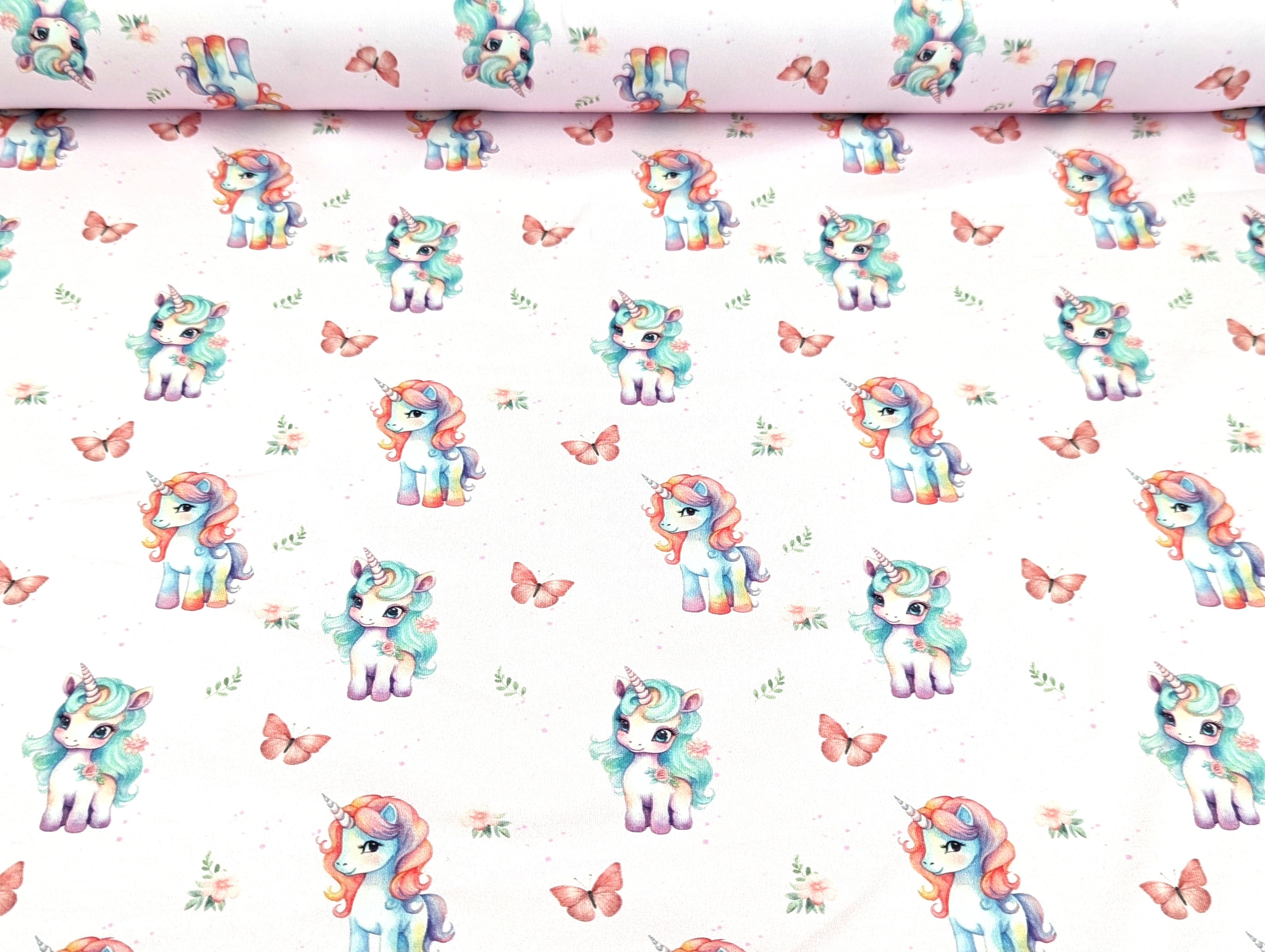 Eigenproduktion Baumwolljersey Regenbogen Unicorn Schmetterling Hellrosa