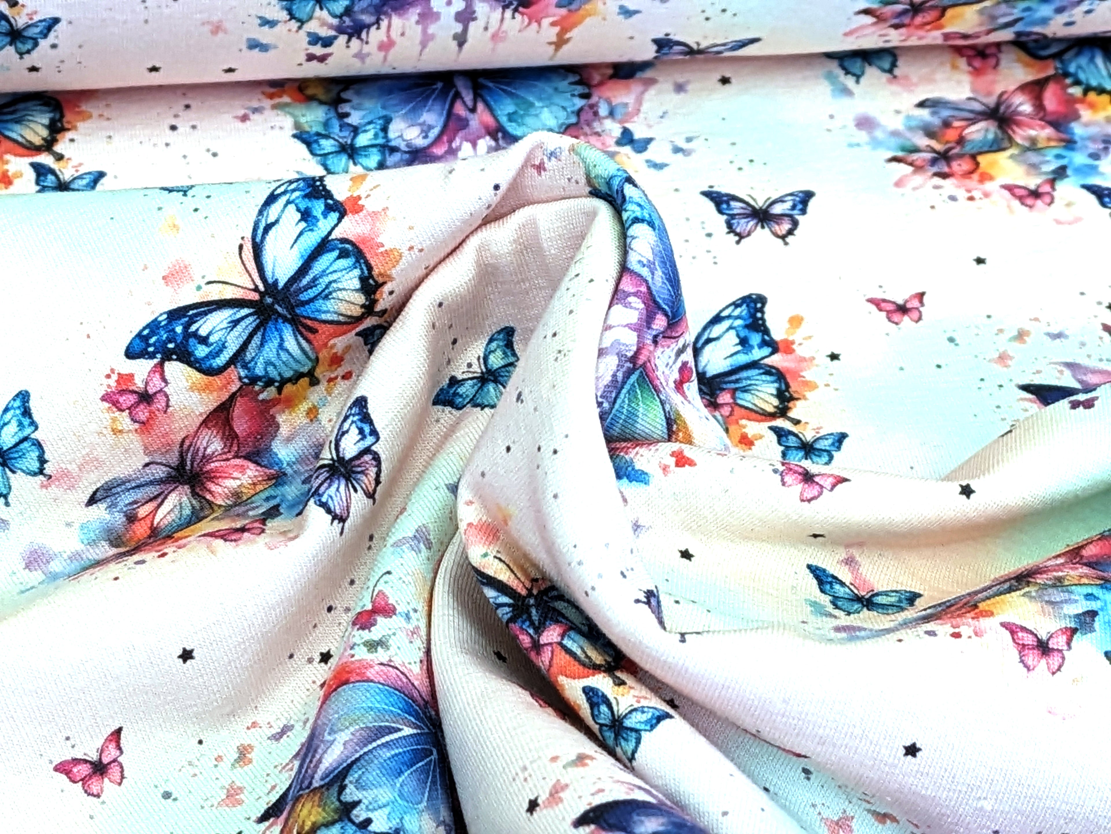 Eigenproduktion Baumwolljersey Regenbogen Schmetterling auf Hellrosa