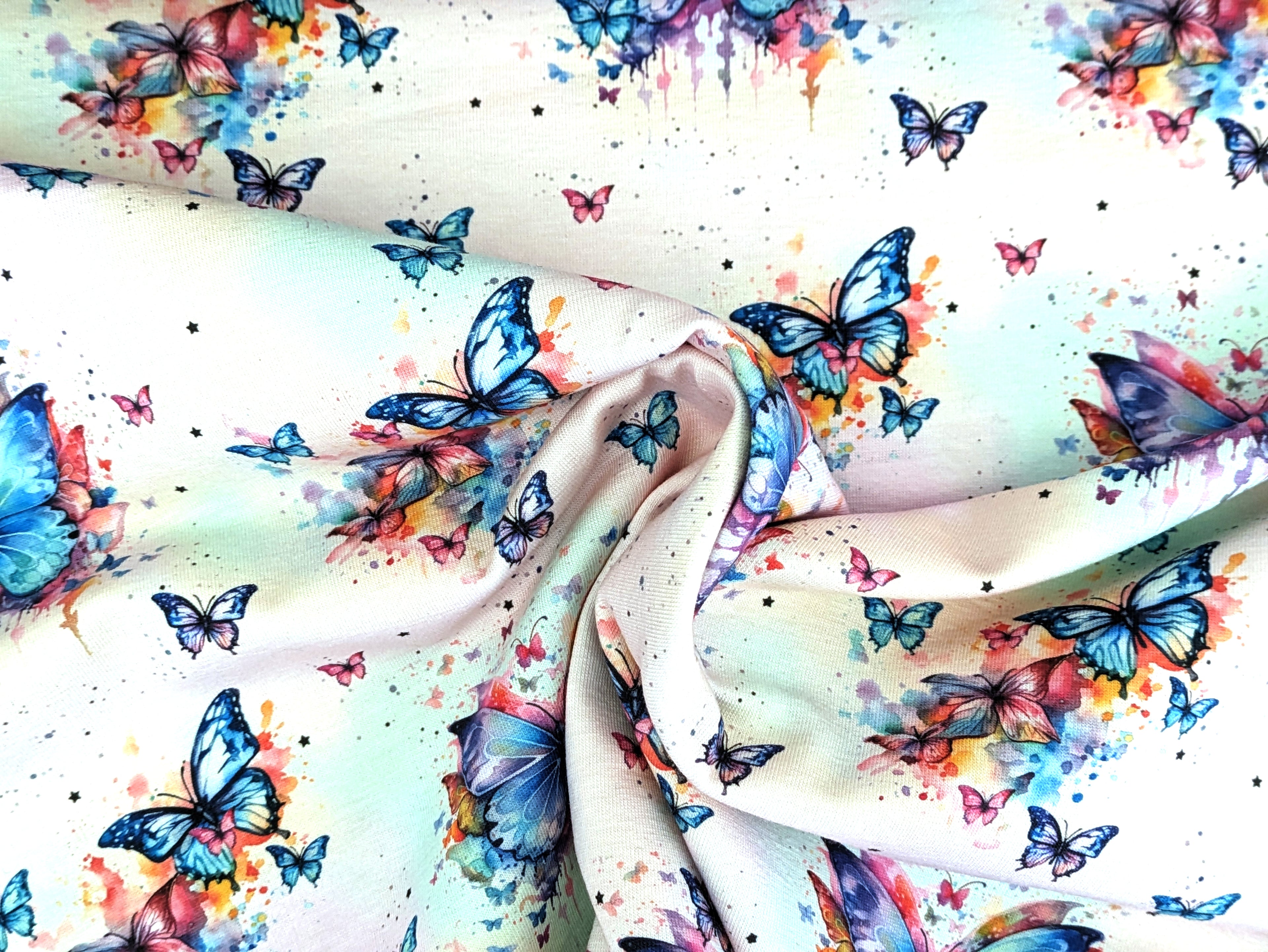 Eigenproduktion Baumwolljersey Regenbogen Schmetterling auf Hellrosa