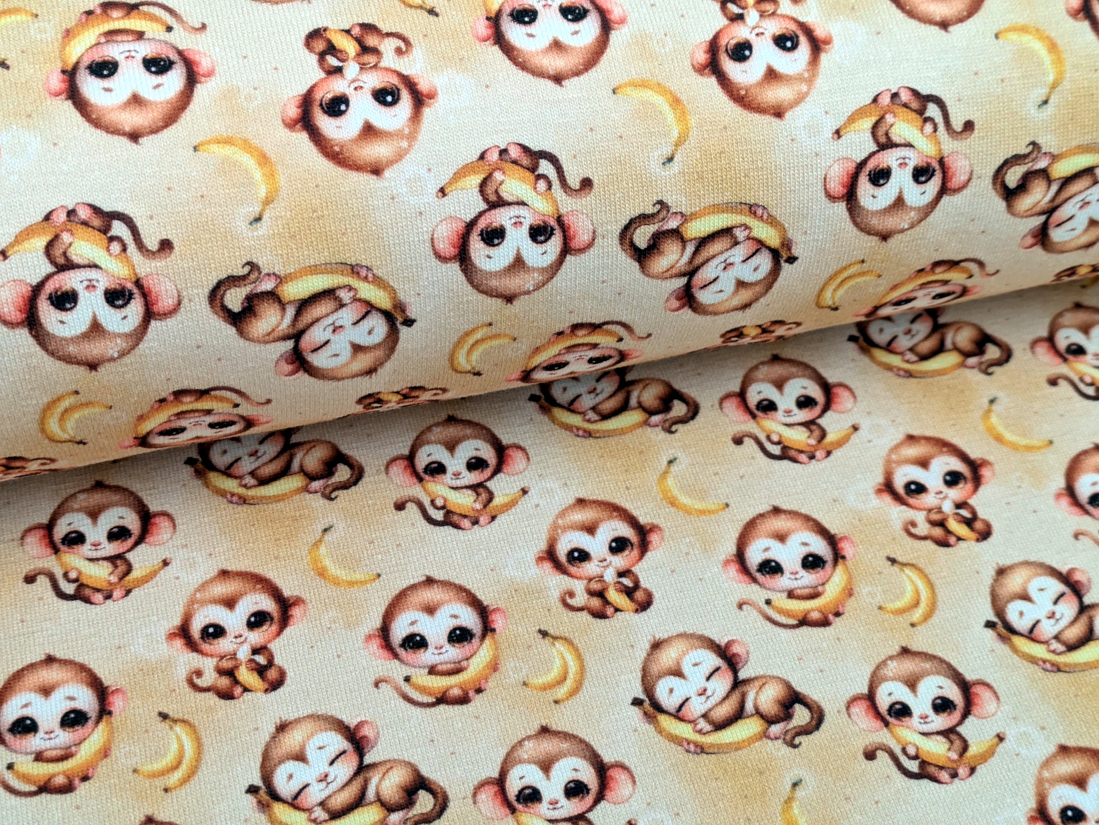 In-house production Cotton jersey Baby monkey and his banana on yellow