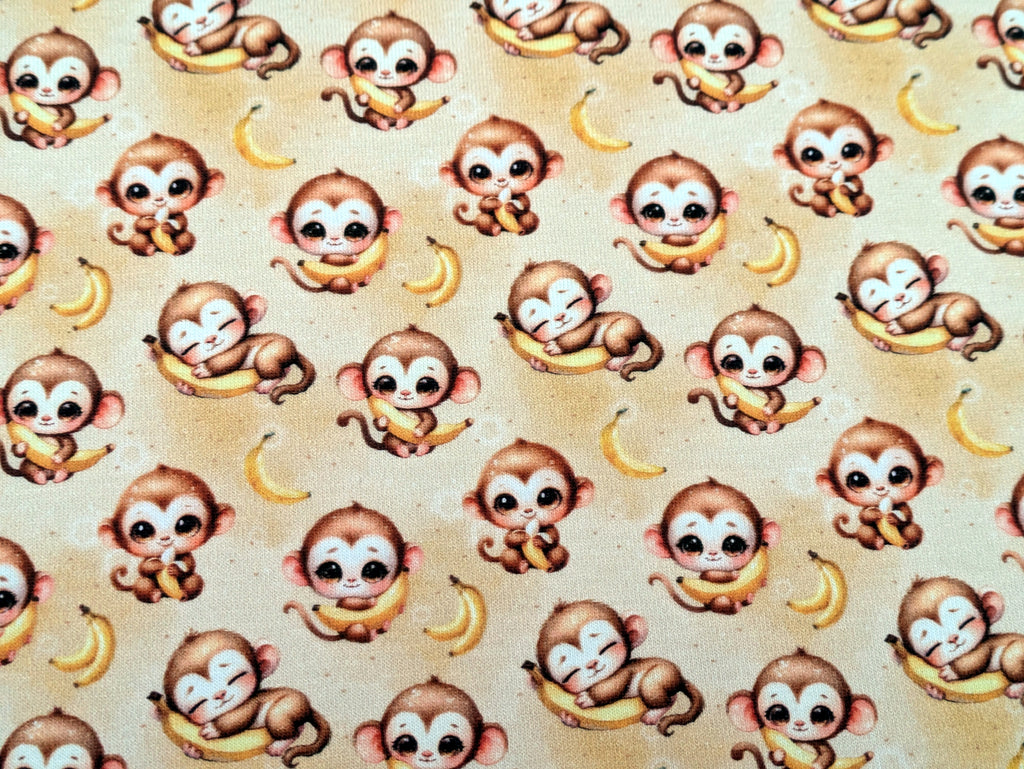 In-house production Cotton jersey Baby monkey and his banana on yellow