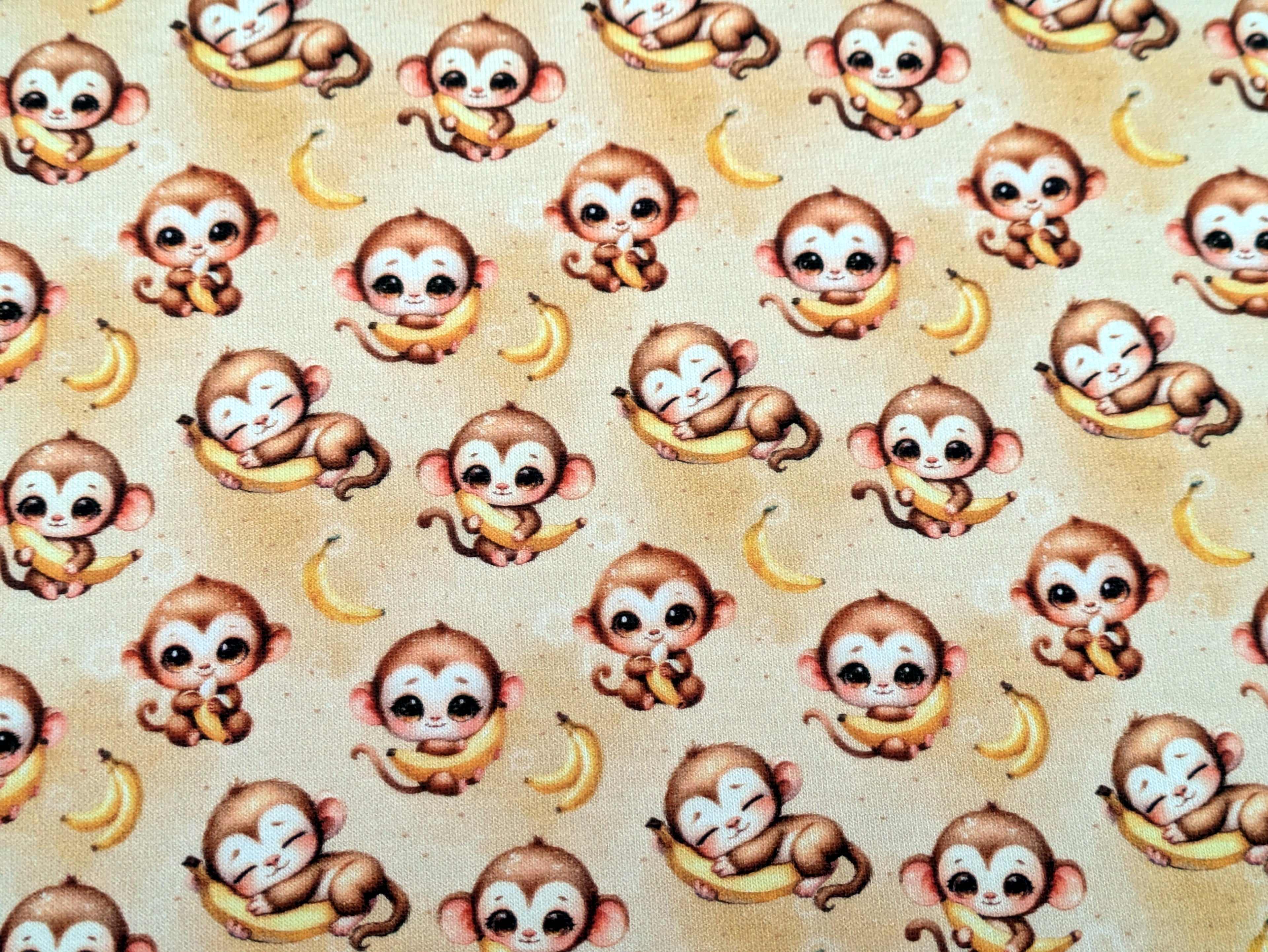 In-house production Cotton jersey Baby monkey and his banana on yellow