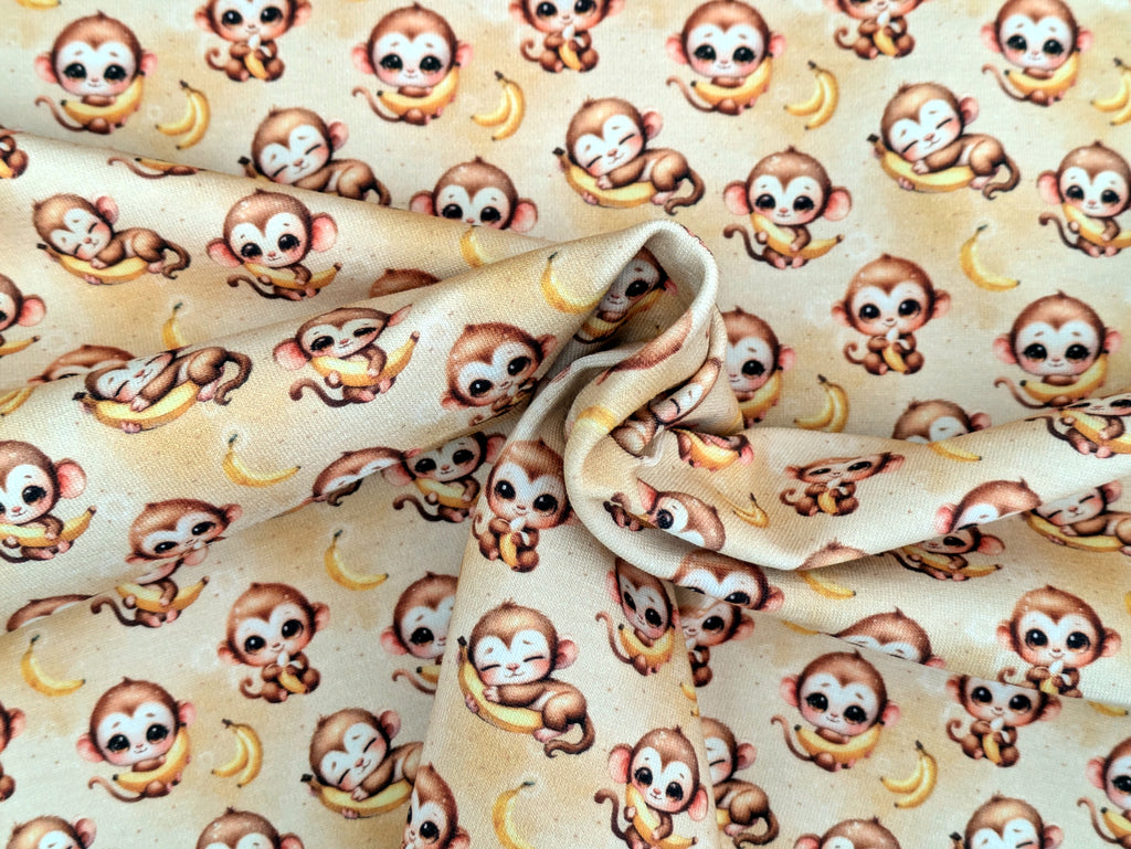 In-house production Cotton jersey Baby monkey and his banana on yellow