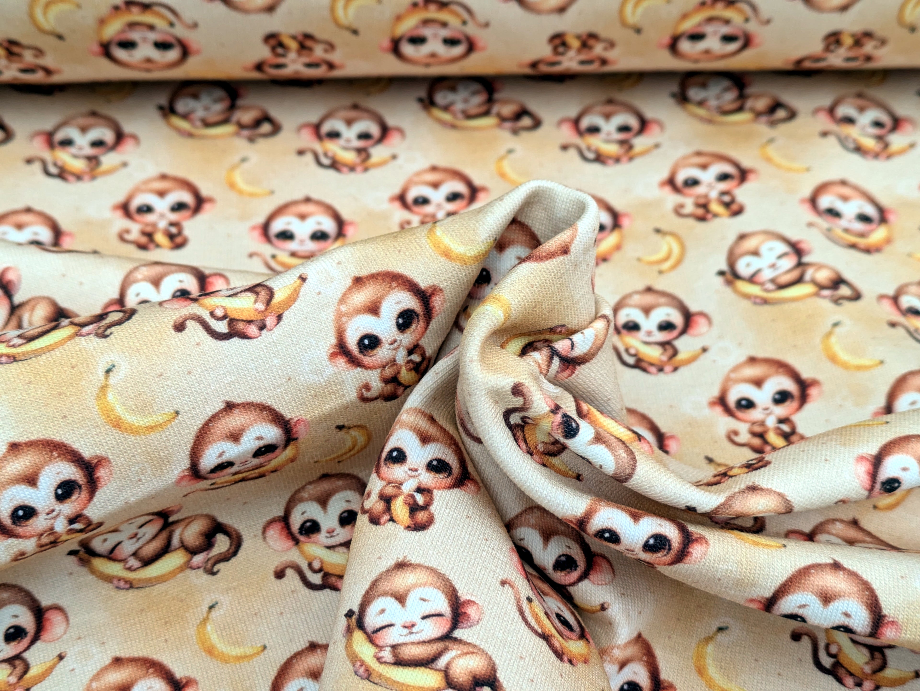 In-house production Cotton jersey Baby monkey and his banana on yellow